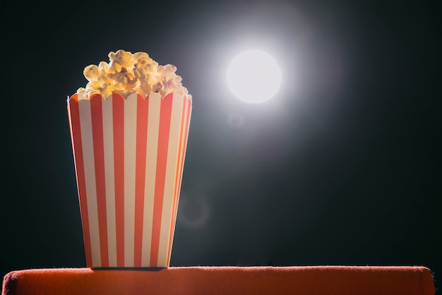 Pop corn on armchair cinema