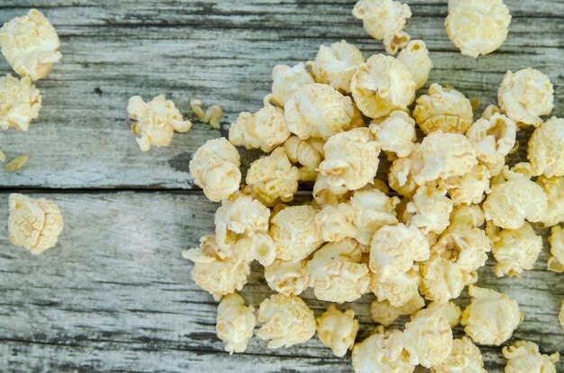 Pop corn ready to eat on rustic wooden white board