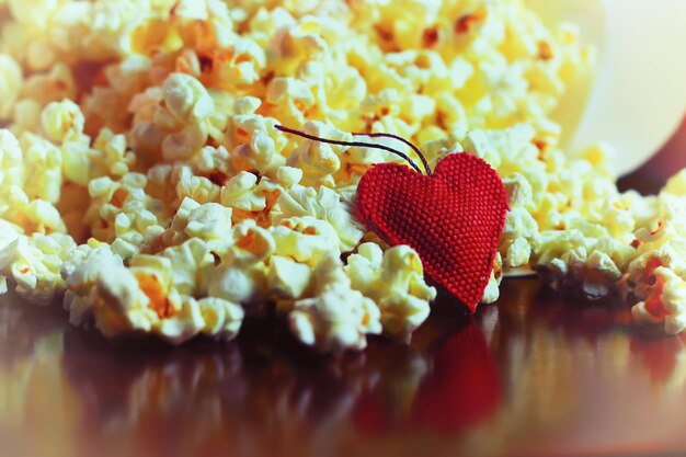 Popcorn basket near candle