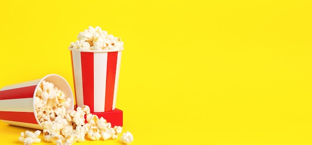 Popcorn Big red white strip box Cinema movie night Pop corn food Yellow background long banner