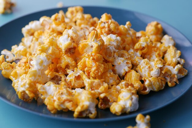 popcorn in a bowl on wooden desk