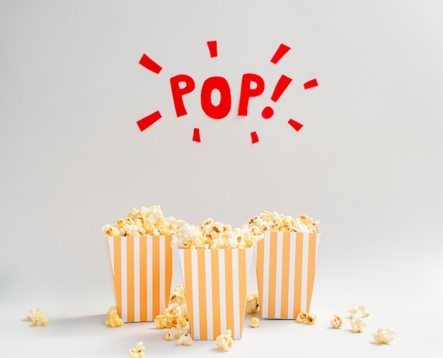 Popcorn boxes with pop sign above