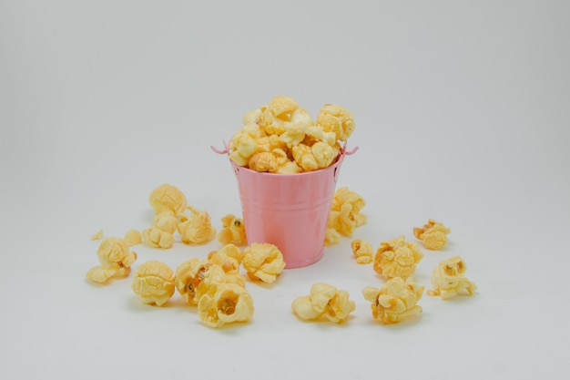 Photo popcorn in a bucket on a white