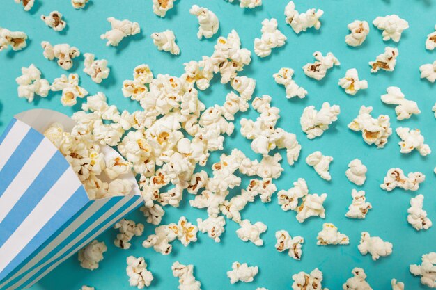 Popcorn on color background