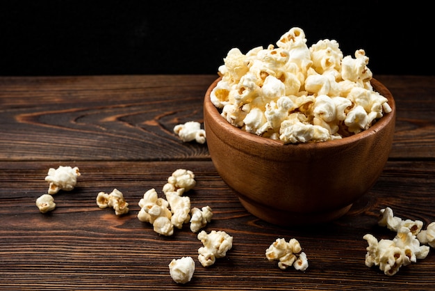 Popcorn on a dark wooden table