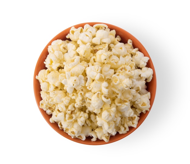 Photo popcorn in  orange bowl isolated on white background