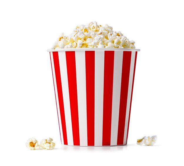 Popcorn in red and white striped bucket isolated on a white background