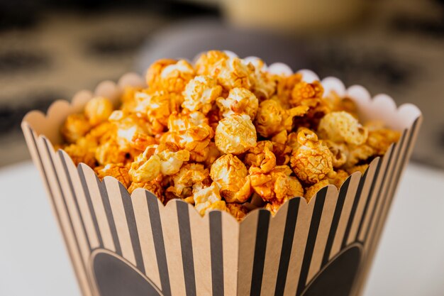 Popcorn in a striped carton box