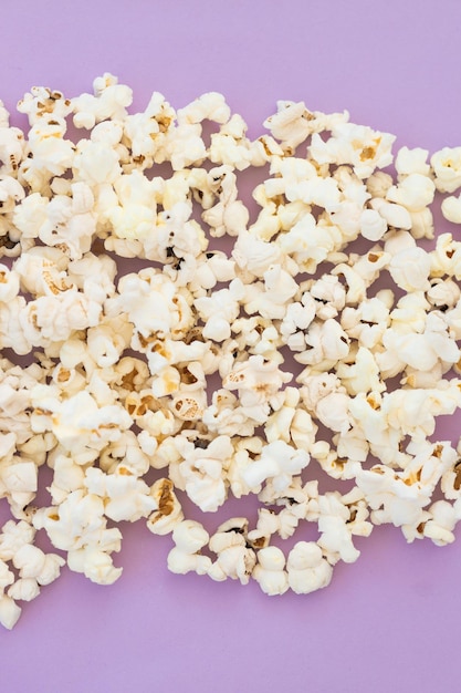 Popcorn on violet background