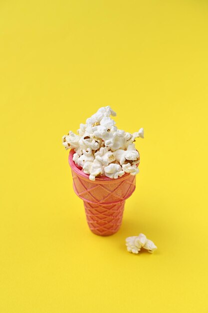 popcorn in a waffle cup on a yellow background