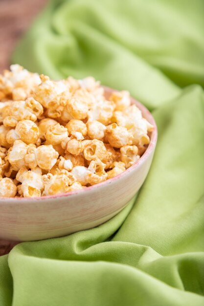 Popcorn with caramel in ceramic bowl