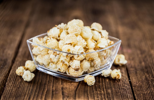 Popcorn on wooden background selective focus