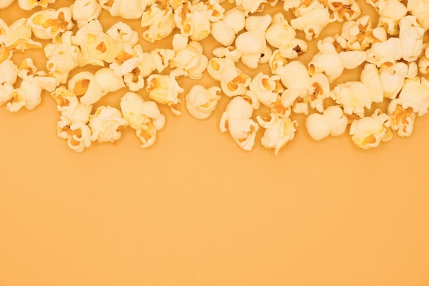 Popcorns isolated on pastel yellow background with copy space Food and snack concepts ideas