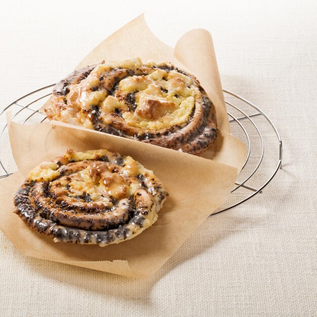 Poppy seed rolls, traditional german Mohnschnecke pastry, on cooling rack