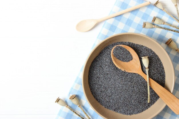 Poppy seeds in a bowl on a table