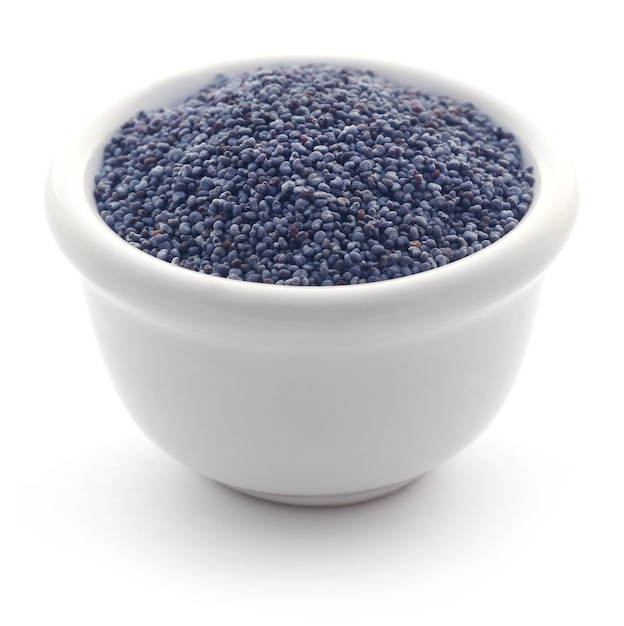 Poppy seeds in a bowl over white background