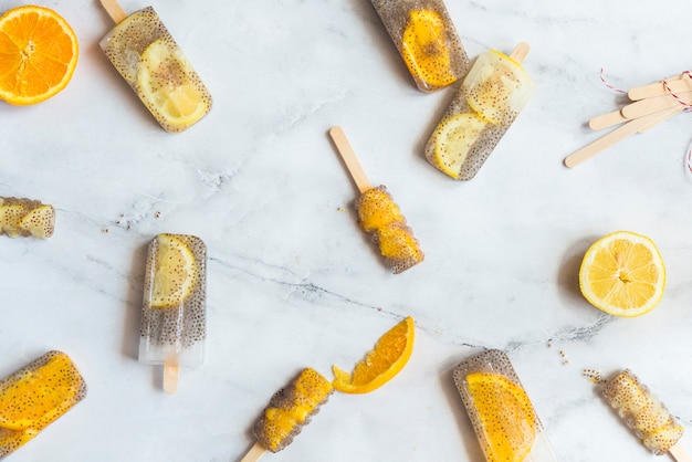 Popsicle of orange and lemon with chia