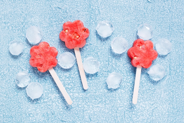 Popsicles of fresh watermelon and ice cubes