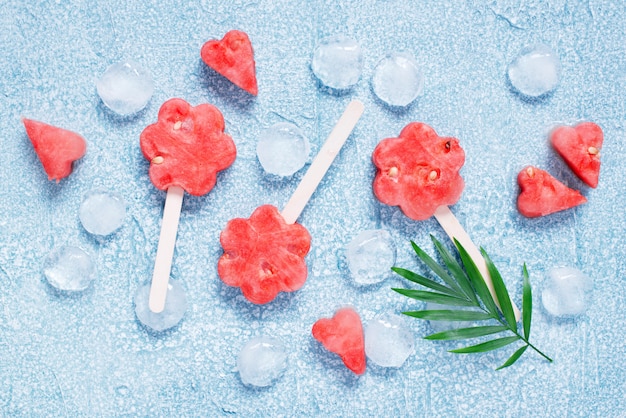 Popsicles of fresh watermelon and ice cubes