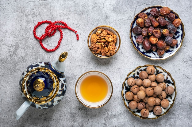 Popular food during Iftar on concrete background