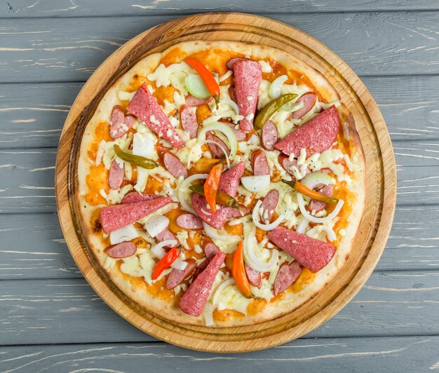 Popular pizza topping in American-style pizzerias on wooden surface