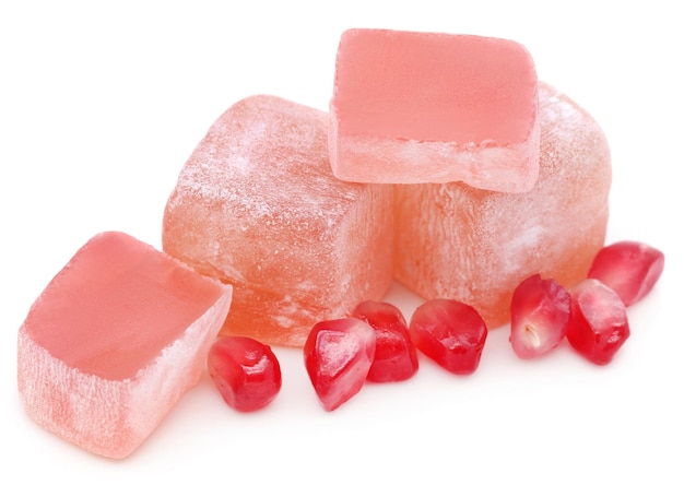 Popular Turkish delight of pomegranate flavor over white background