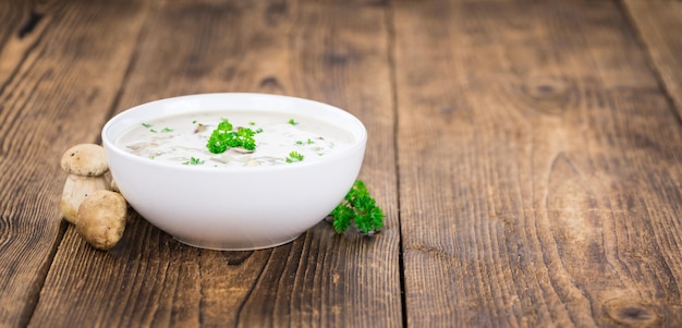 Porcini Soup on vintage wooden background