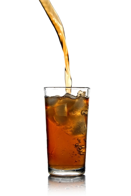 Poring cola into glass isolated on white