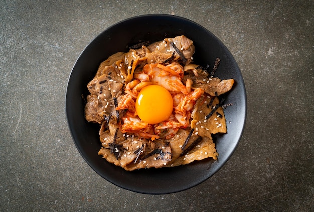 Pork bulgogi rice bowl with kimchi and Korean pickled egg