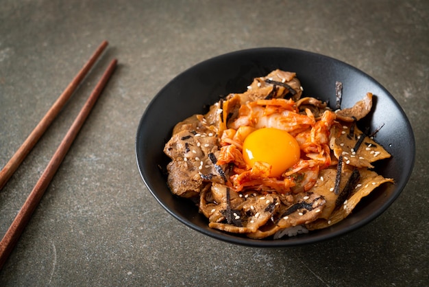 pork bulgogi rice bowl with kimchi and Korean pickled egg