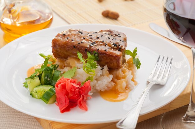 Pork cheek with rice broken cucumbers and ginger