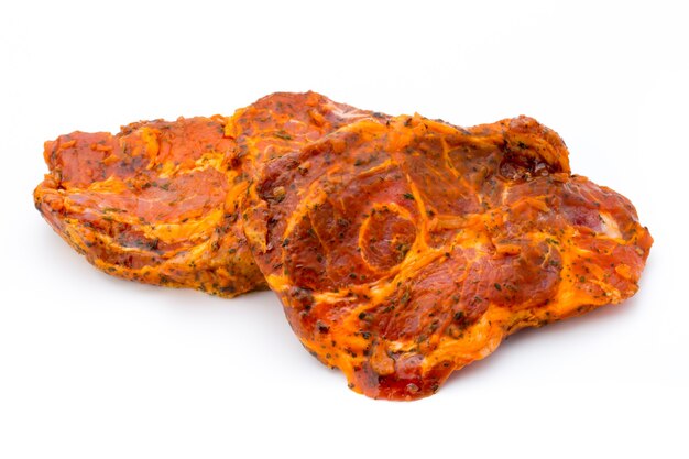 Pork chop, marinated. Isolated on white.