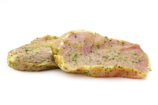 Pork chop, marinated. Isolated on white.