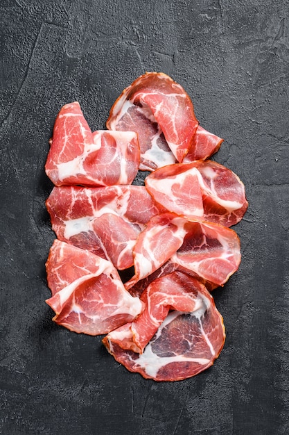 pork cured meat on dark background