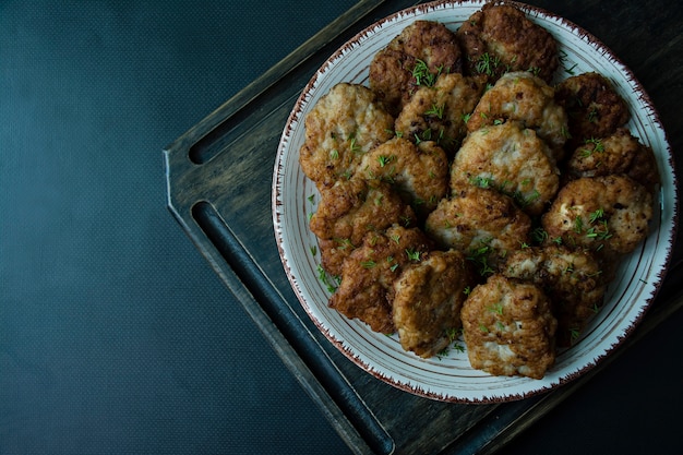 Pork cutlets on a plate.