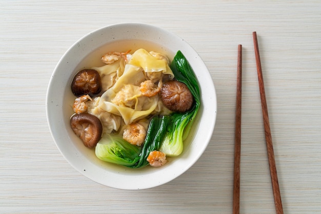 Pork dumpling soup with shrimps and vegetable