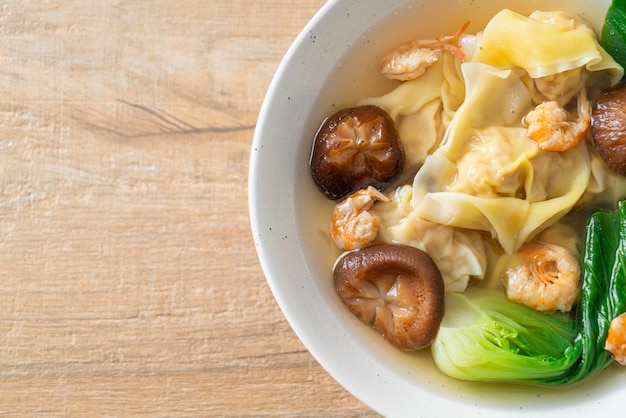 Pork dumpling soup with shrimps and vegetable