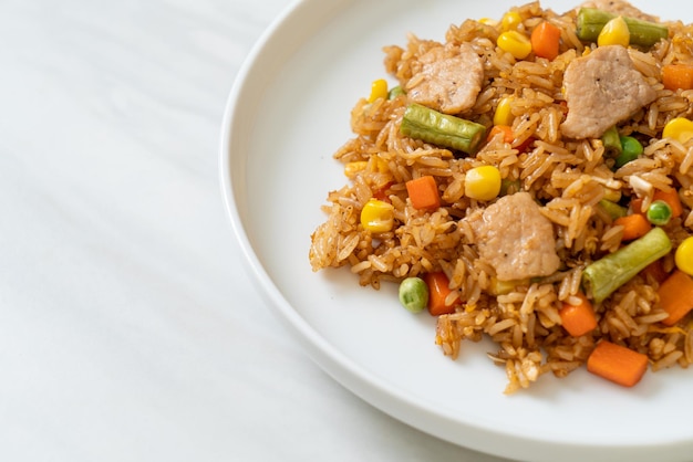 Pork fried rice on white plate