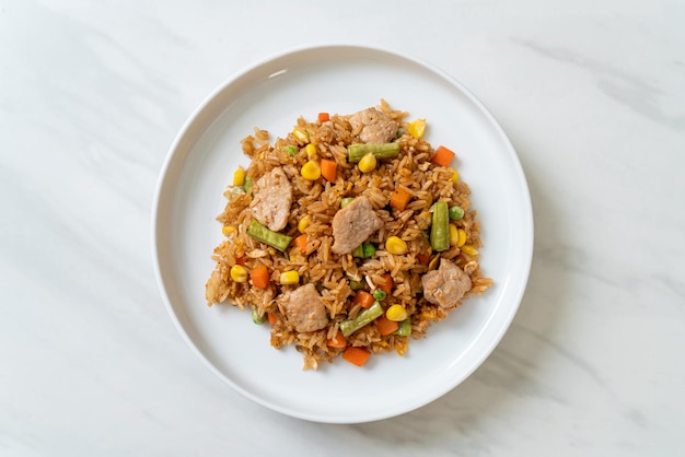 Pork fried rice on white plate