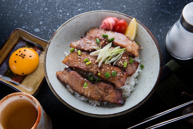 Photo pork grill on rice or buta yaki don.