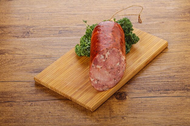 Pork ham sausage over board