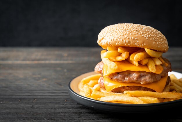 pork hamburger or pork burger with cheese and french fries