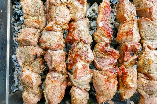 pork kebab on the fire cooking pork kebab on skewers hot meat in the fresh air after frying