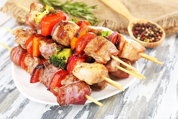 Pork kebab on wooden table close up