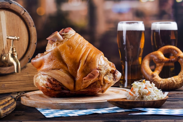 Pork knuckle, beer and pretzels