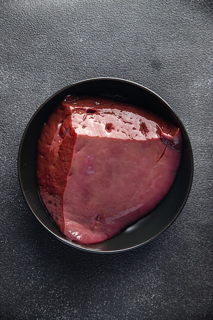 Pork liver offal fresh piece of pork meat healthy meal food snack on the table copy space food