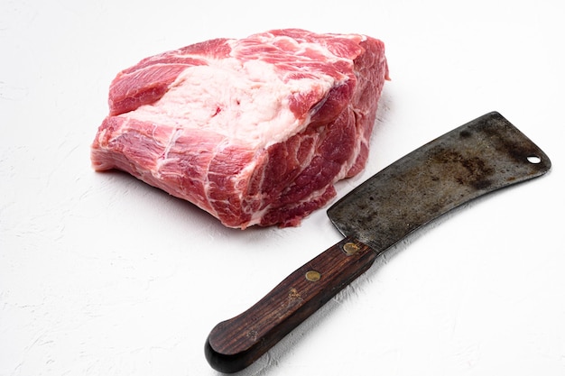 Pork Neck meat steak set , with old butcher cleaver knife, on white stone table background