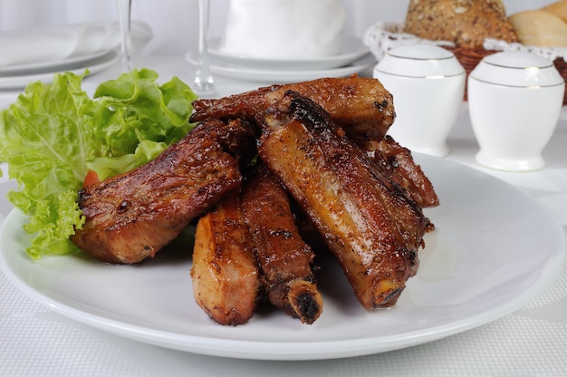 Pork ribs in honey and soy sauce with garlic