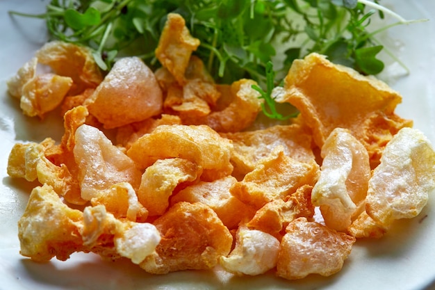 Pork rinds appetizer on white dish