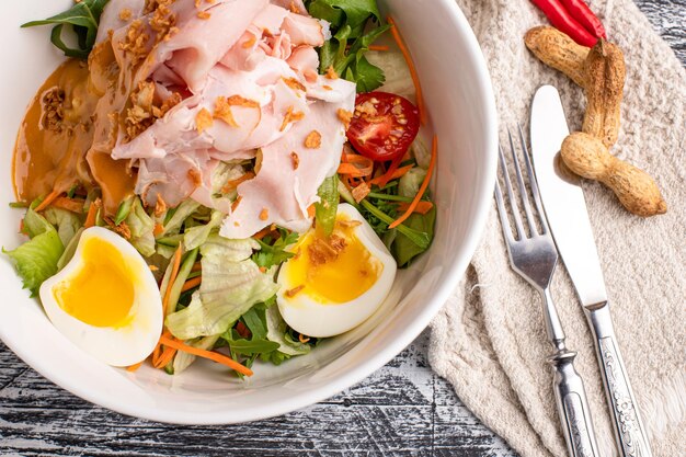 Pork salad salad on a white background side and top view